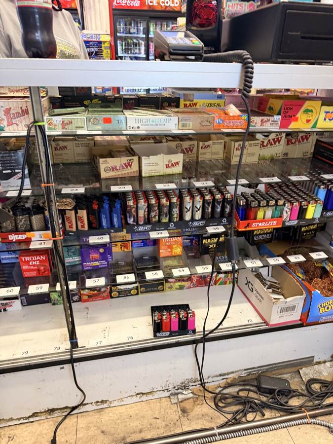 Papers and lighters behind the counter